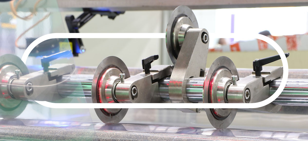 industrial blades cutting into a film material